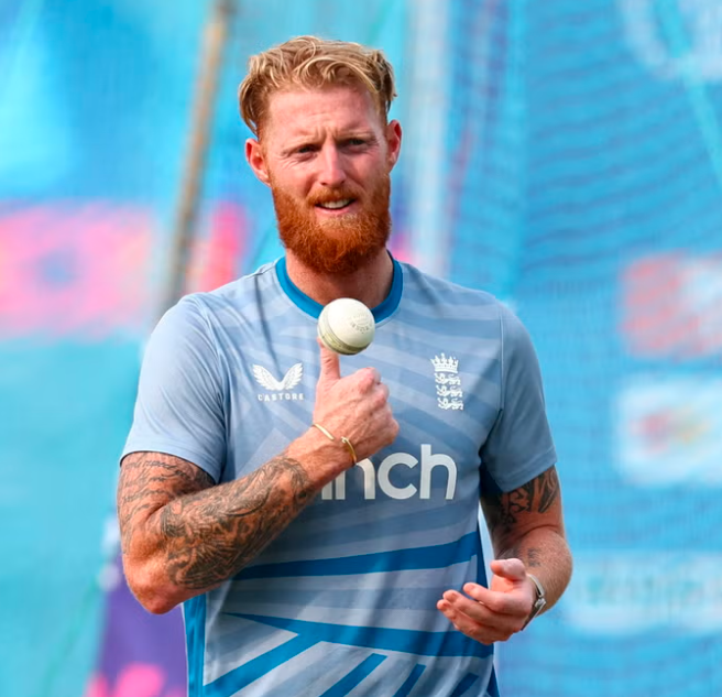 Ben Stokes walking off the field with a determined expression.