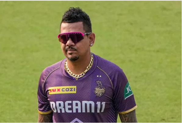 Image showing Sunil Narine in cricket gear, with text overlay indicating his decision to rule out a return to international cricket.