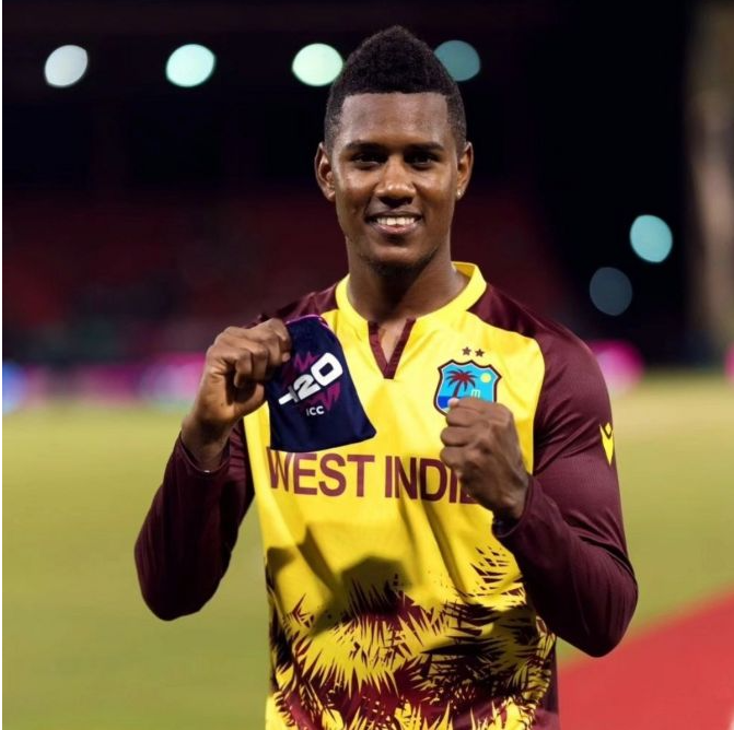 West Indian spinner Akeal Hosein celebrates after taking a wicket during the T20 World Cup 2024 match against Uganda.